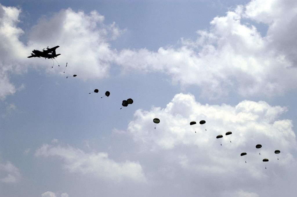 US_Navy_040514-N-0295M-019_A_U_S__Air_Force_C-130_Hercules_drops_a_large_stick_of_paratroopers_assigned_to_the_U_S__Army_82n_zps33c0e293.jpg