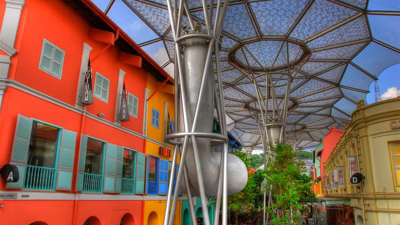  a historic street being covered by a canopy is Clark Quay in Singapore