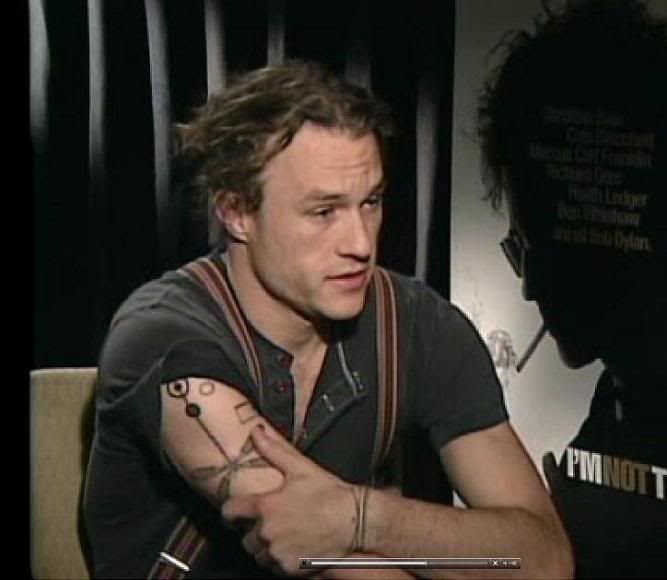 Heath has connected the dragonfly and the previous tattoo of the earth, sun, 