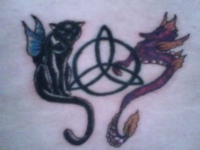 http://tribal-skulltattoos.blogspot.com/images/black_cat_tattoos_and_eagle_animal.jpg